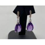 An impressive pair of silver and pear shaped Amethyste drop earrings 5.9g