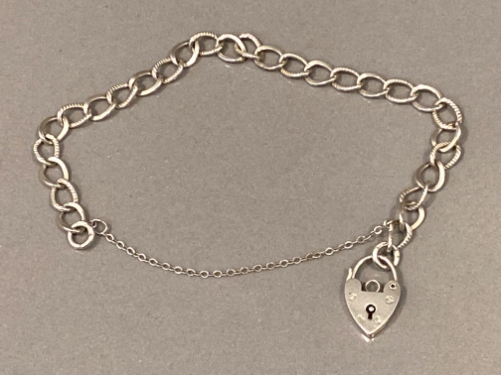 Silver charm bracelet with heart shaped padlock 7.8g