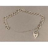 Silver charm bracelet with heart shaped padlock 7.8g