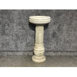 Solid column style bird bath with floral decoration