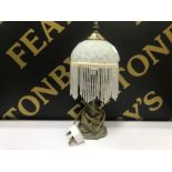 Art nouveau style brass effect table lamp with beaded shade