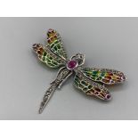 A large silver plique a jour butterfly brooch-pendant with ruby panel