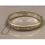 Silver, hollow half engraved bangle, 20.4g