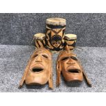 3 piece antique African drum set together with a pair of African wall masks