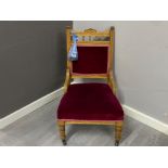 Oak framed nursing chair with red velvet back & seat (back right castor needs reattached)