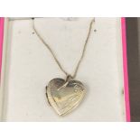 Silver heart shaped locket on chain