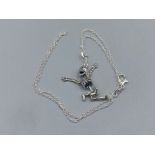 A silver skeleton pendant necklace on silver chain, 6.2g 46cm length