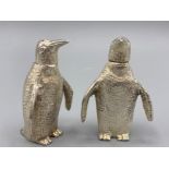 A pair of silver plated unusual silver plated penguin condiments