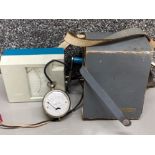 Vintage Megger meter with original case together with a voltmeter