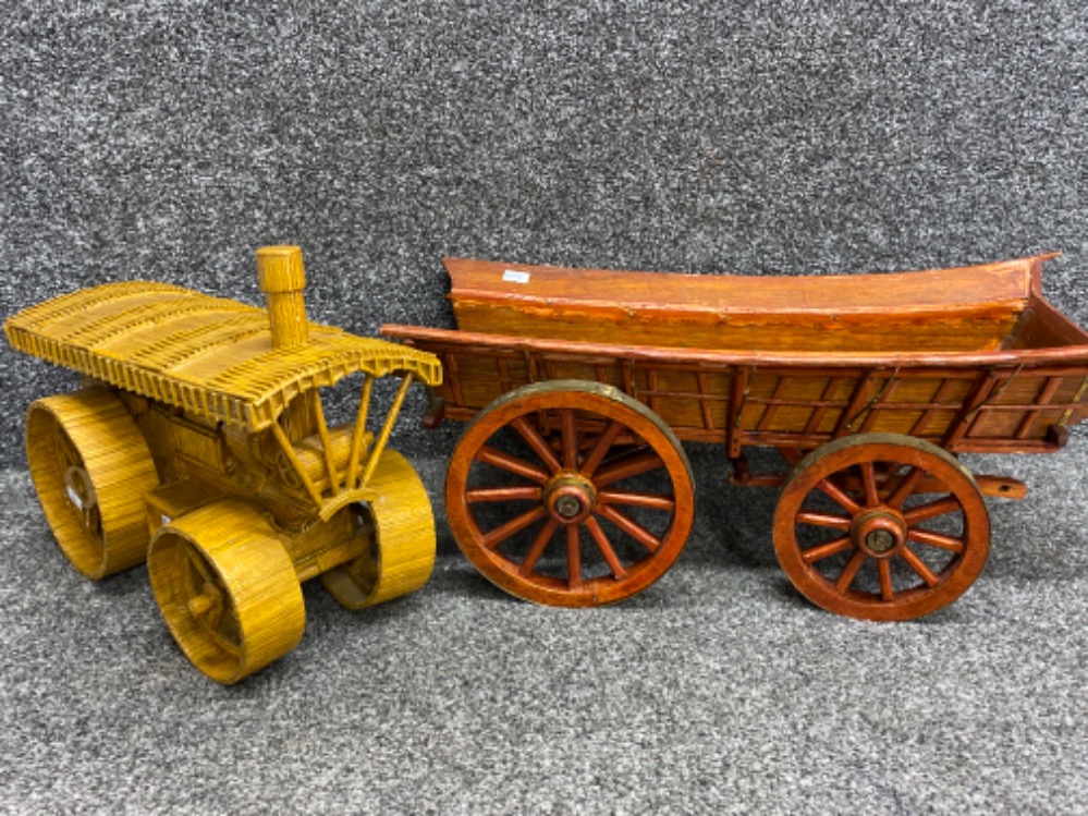 A large Matchstick model of a steam roller together with a handmade wooden model horse cart