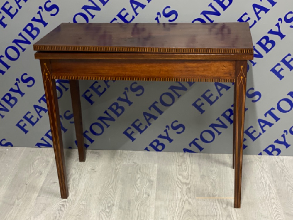 Inlaid mahogany turn over top table