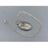 A silver photo locket with embossed horse set to the case, 9.3g 47cm long