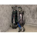 2 golf bags containing a variety of clubs & 2x trolleys