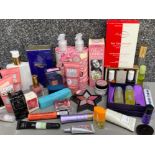 Box containing a various amount of woman’s beauty products, including soaps, perfume & make-up