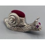 A silver snail pincushion, 5.6g