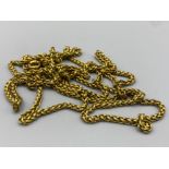 A long brass albert style watch chain