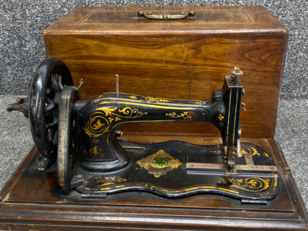 Vintage Jones sewing machine with original carry case