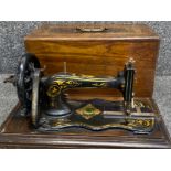 Vintage Jones sewing machine with original carry case