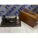 Vintage Jones sewing machine with original carry case