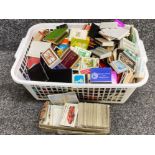 Crate containing a large quantity of miscellaneous unused matchboxes & cigarette cards