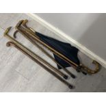 Bundle of vintage wooden walking sticks & umbrella