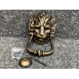 A reproduction cast metal 10 Downing Street knocker in the form of a lion