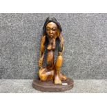 Tall 22” hand carved sitting nude lady with leopard skin bag on her arm