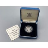 Royal Mint 1989 silver proof one-pound coin in protective capsule, with original case