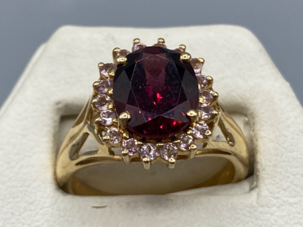 A rose gold with large garnet surrounded by diamonds 2ct’s total approx, 4.8g size N1/2
