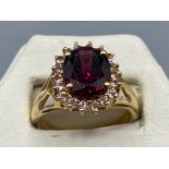 A rose gold with large garnet surrounded by diamonds 2ct’s total approx, 4.8g size N1/2