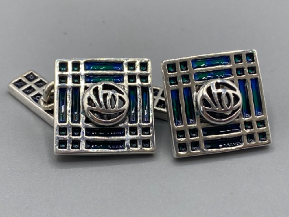 A pair of silver and enamel set Tiffany style cufflinks, 12.6g