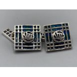 A pair of silver and enamel set Tiffany style cufflinks, 12.6g