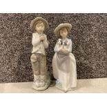 2x NAO by Lladro figures 1 boy holding a bird 1 girl holding dogs