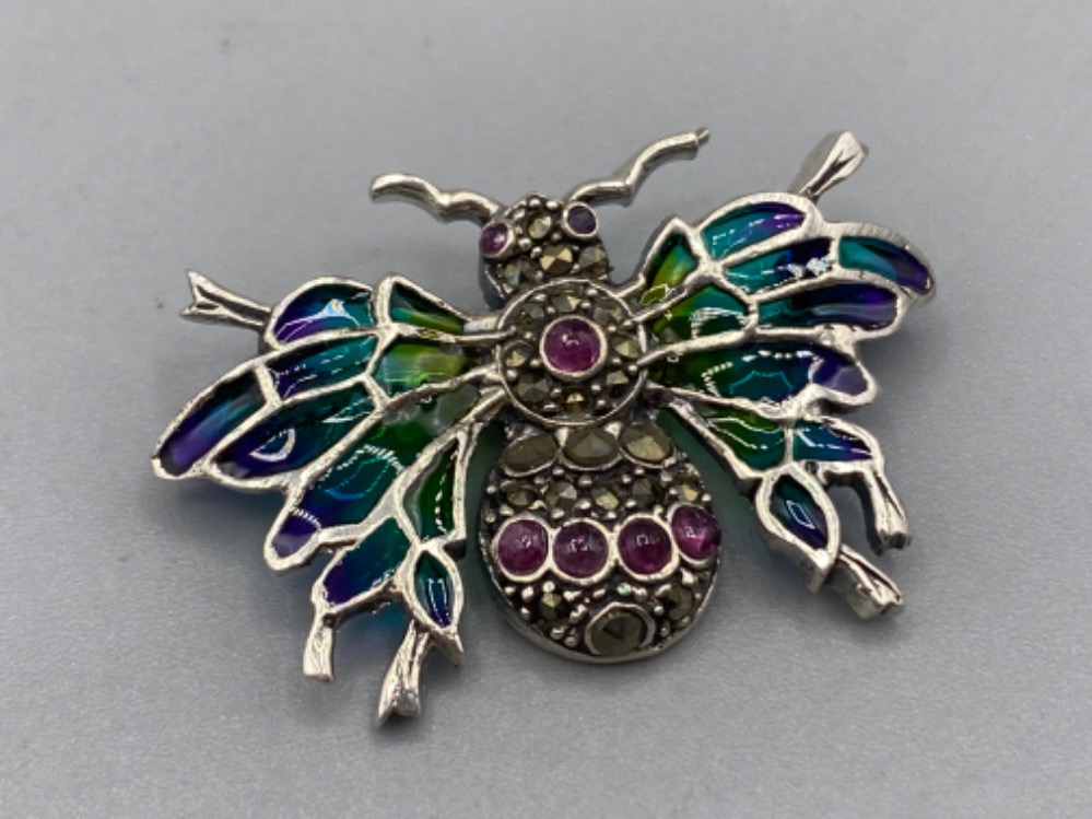 A silver and plique a jour bug brooch set with rubies, 4g