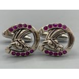 A pair of silver and ruby set horseshoe shaped cufflinks, 10.7g