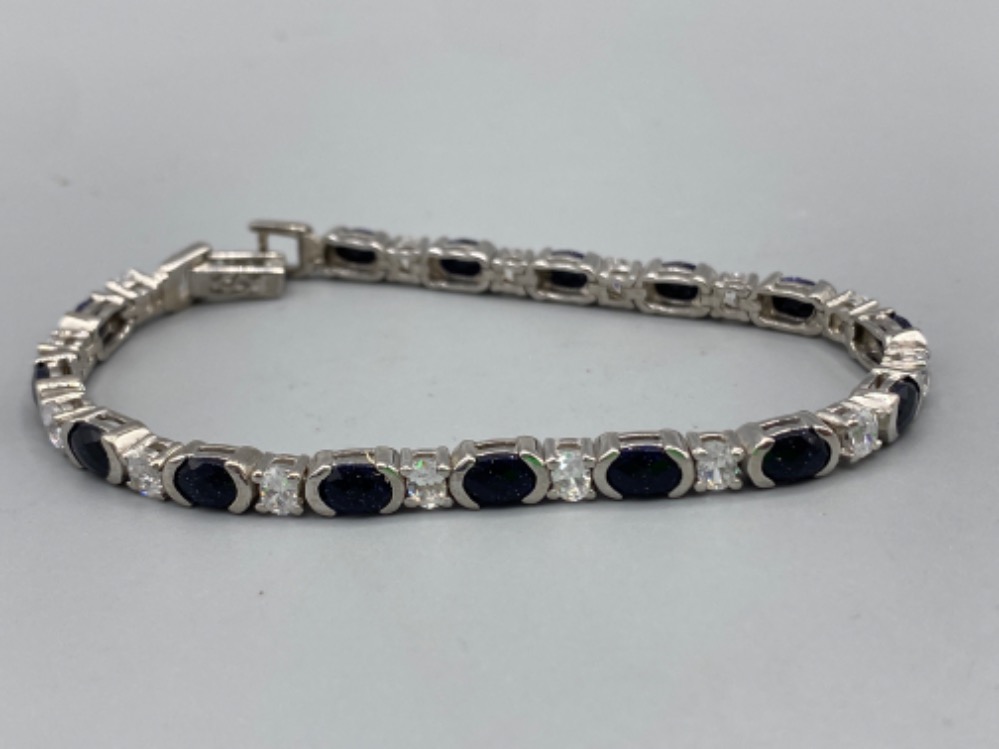 A silver CZ and sapphire line bracelet, 13.9g 19cm length