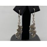 A pair of silver and marcasite snake drop earrings, 5.6g