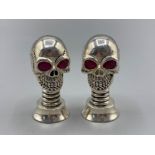 A pair of silver plated novelty condiments in the form of skulls, 62.2g