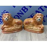 Pair of vintage Staffordshire lions with glass eyes