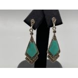 A pair of silver art deco style earrings set with marcasite’s and turquoise panels, 4.8g