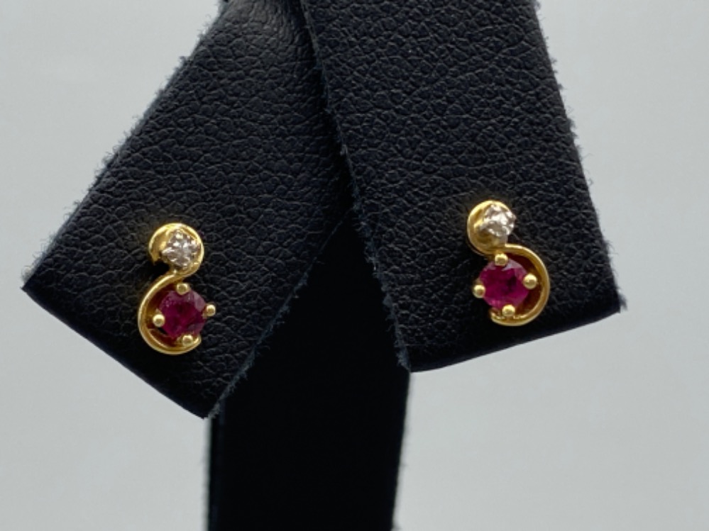 A pair of yellow gold ruby and diamond stud earrings, 1.1g