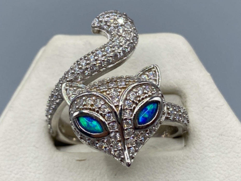 A silver and cz ring in the form of a fox with opal eyes, 5.2g size P