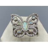 A silver cz and opal panelled dress ring in the form of a butterfly, 6.2g size T