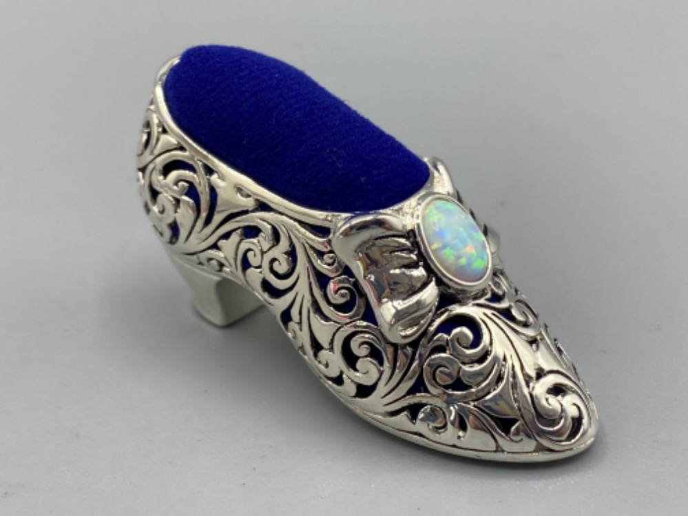 A silver plated pincushion in the form of a shoe with opal cabochon