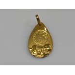 18ct gold pendant (religious themed) 1.1g