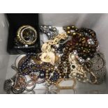 A box of miscellaneous costume jewellery to include bangles beaded necklaces etc