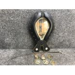 Folk art mirror set in polished leather horse collar together with horse whip and horse brasses