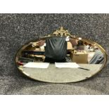 Brass oval shaped wall mirror with grapevines design