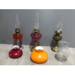 3 vintage oil lamps with spare shades