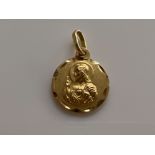 18ct gold religious figure pendant. 1.2g